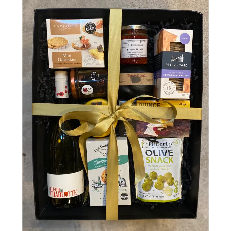 Hamper full of delicious products finished with gold ribbon